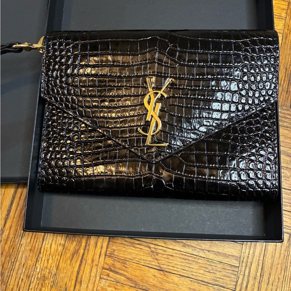 Yves Saint Laurent Glossy Black Crocodile-Embossed Wristlet with Gold Emblem